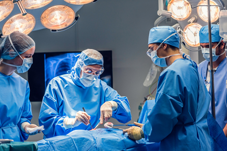 Surgeon team operating.